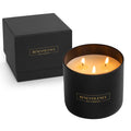 Black candle with 'Benevolence Los Angeles' branding next to a matching black box on a white background.